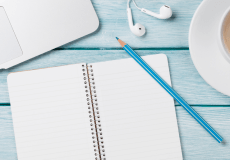 Blank notebook on desk waiting to be filled with ideas